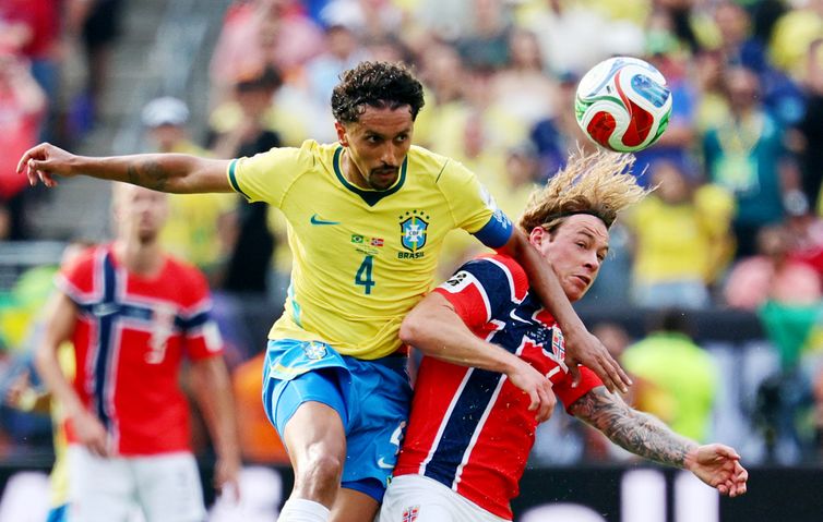 Vincent Carchietta/Reuters/proibida reprodução Soccer Football - FIFA World Cup 2026 - Round of 16 - Brazil v Norway - New York New Jersey Stadium, East Rutherford, New Jersey, U.S. - July 5, 2026 Brazil's Marquinhos in action with Norway's Patrick Berg IMAGN IMAGES via Reuters/Vincent Carchietta